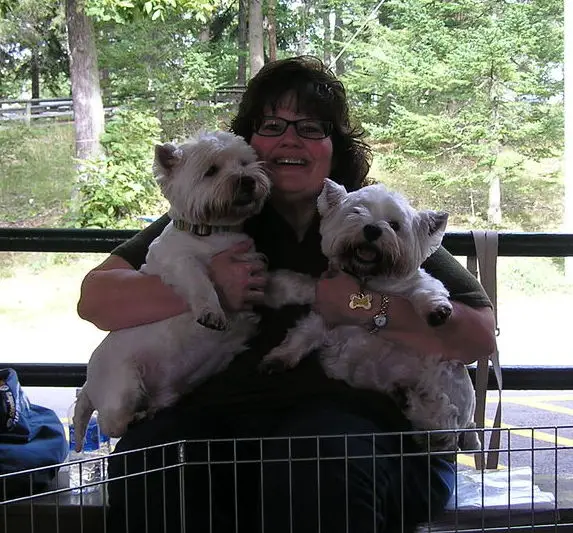 1356944705~A-woman-with-her-Westie-Staff-puppies.jpg